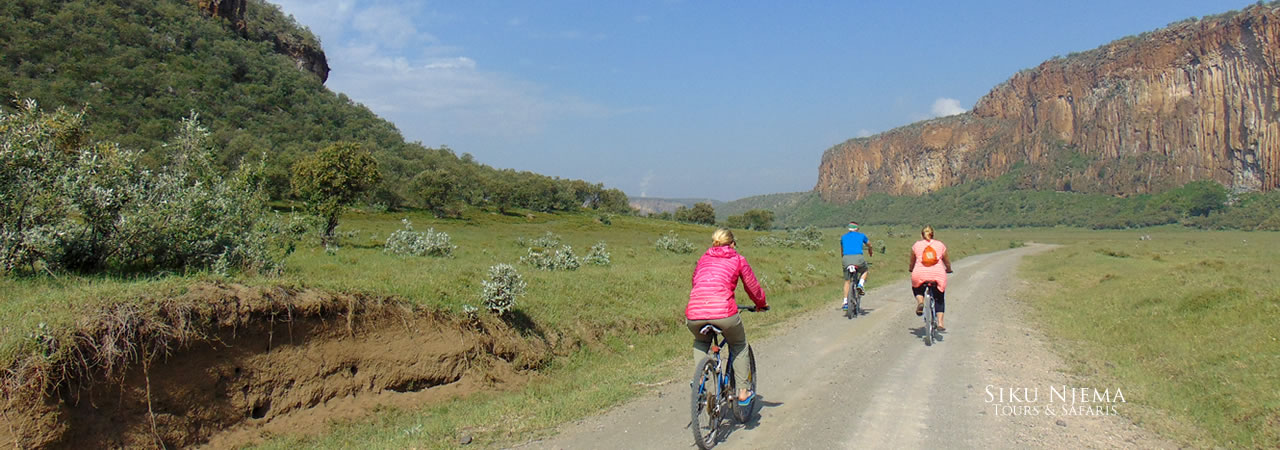 Tourists enjoying bicycle riding safari in Hell's Gate National Park, Kenya